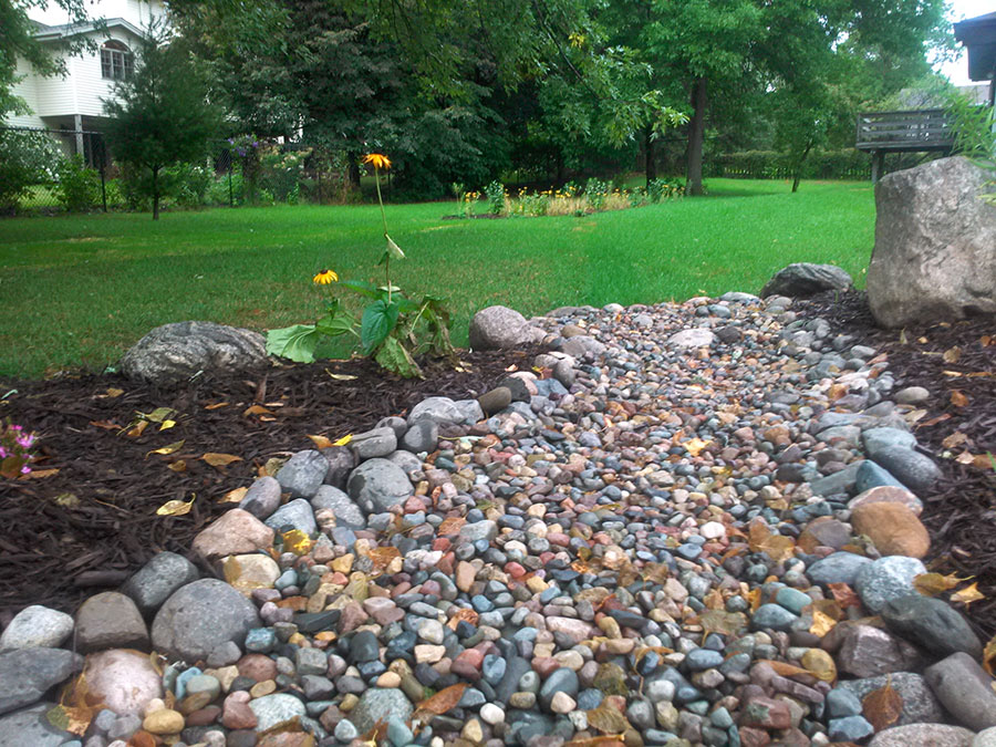 A rock bed rain garden to help with runoff water